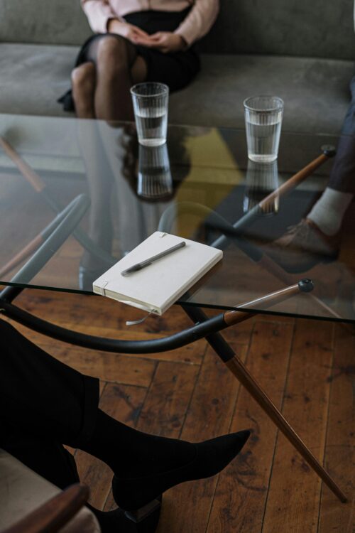 An image of a office table with a notebook on it.